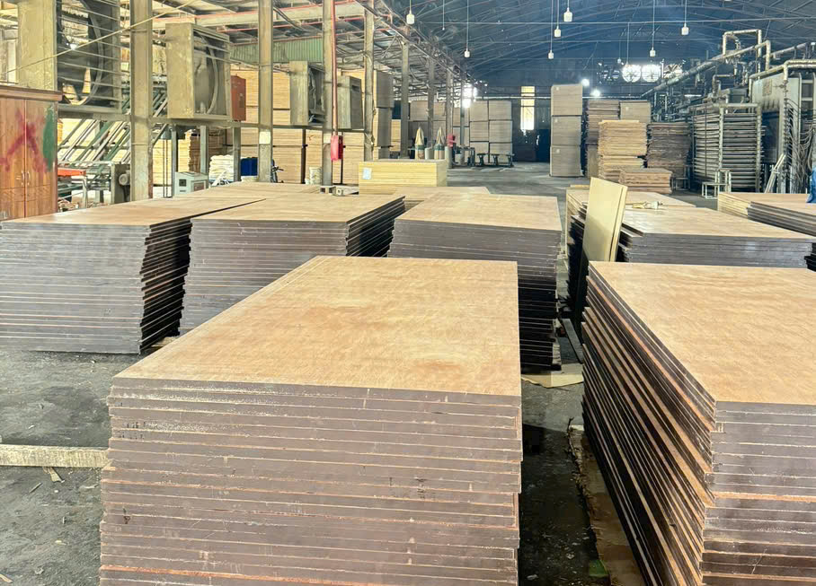 Plywood panels stacked inside the factory